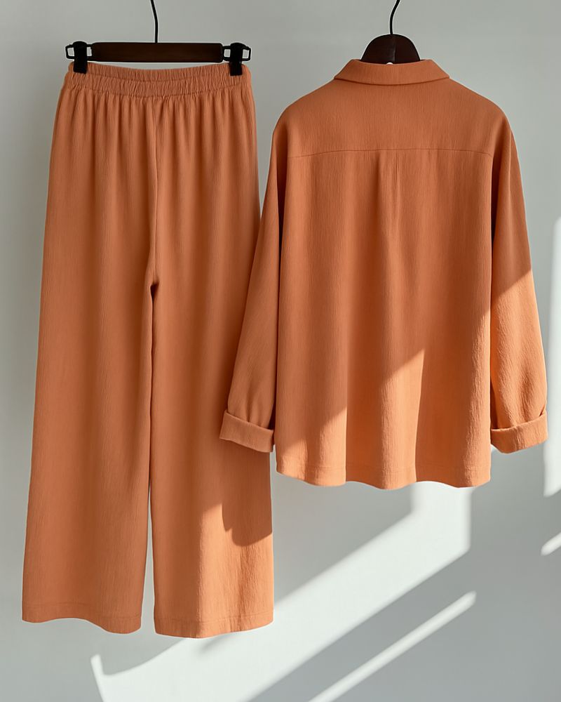 Back view of relaxed crinkle cotton shirt and pants in sunbaked clay color