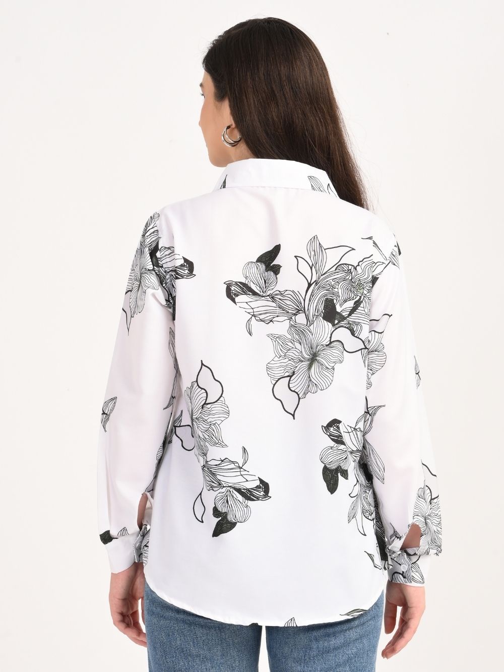 Back view of white shirt with bold black floral design