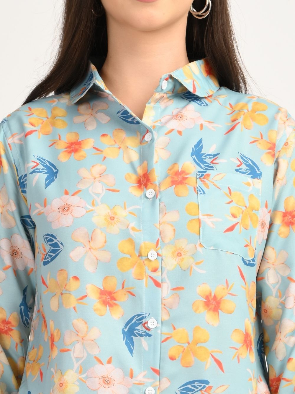 Close-up of aqua blue floral print shirt with yellow flowers