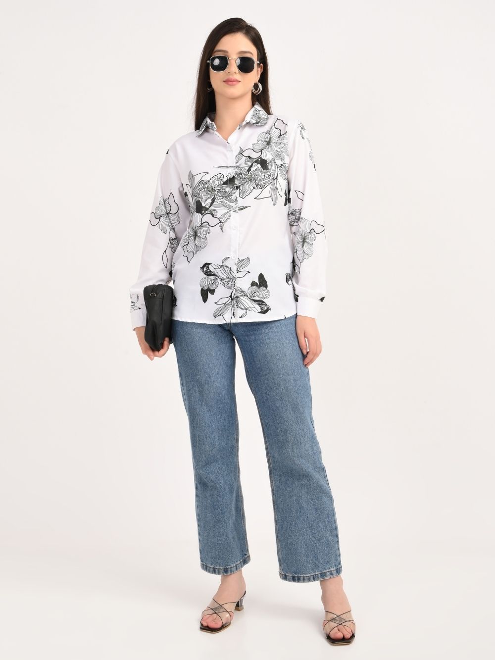 Full body view of woman in floral shirt with jeans
