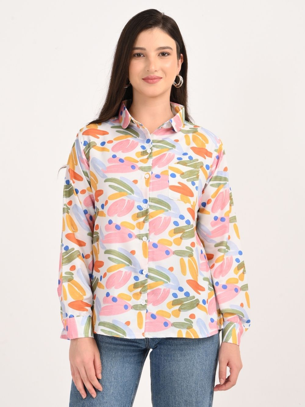 Woman smiling in multicolor brushstroke print shirt, front view