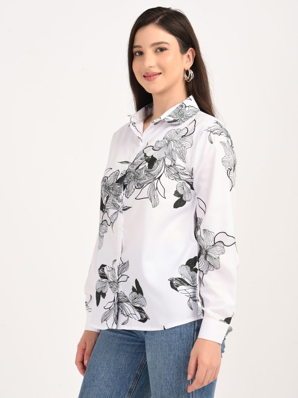 Angled side view of black and white floral shirt