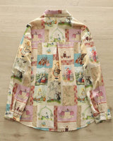 "Back of the Pennywhistle Meadow shirt featuring fairytale scenes"

