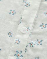 Close-up of Celeste Bloom women's rayon shirt showing soft floral print and white button detailing on lightweight fabric

