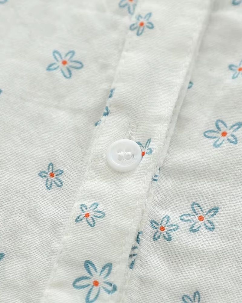 Close-up of Celeste Bloom women's rayon shirt showing soft floral print and white button detailing on lightweight fabric

