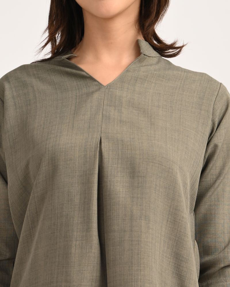 Close-up of V-neckline and collar detail on olive green linen blend kurta