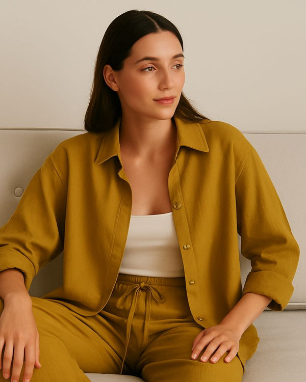 “Close-up of double gauze cotton button-up shirt in mustard yellow with chest pocket”

