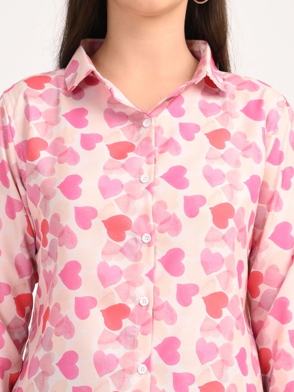 Close-up of pink heart print shirt buttons and collar