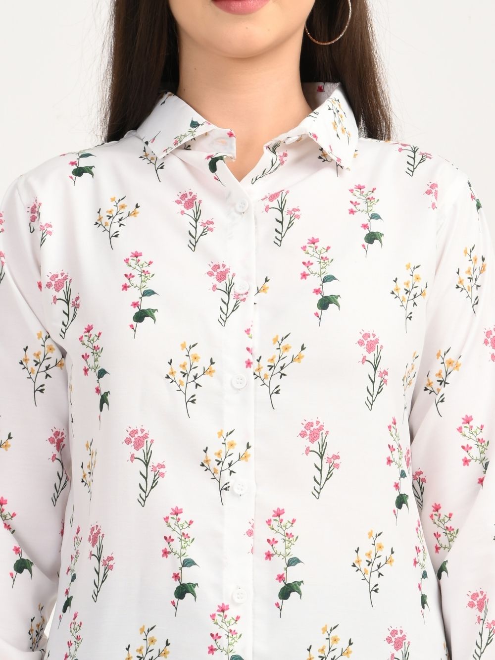 Close-up of white shirt with pink and yellow floral print
