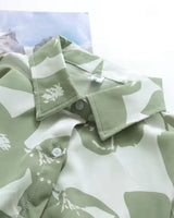 Collar detail of Verde Amour green and white printed shirt for women

