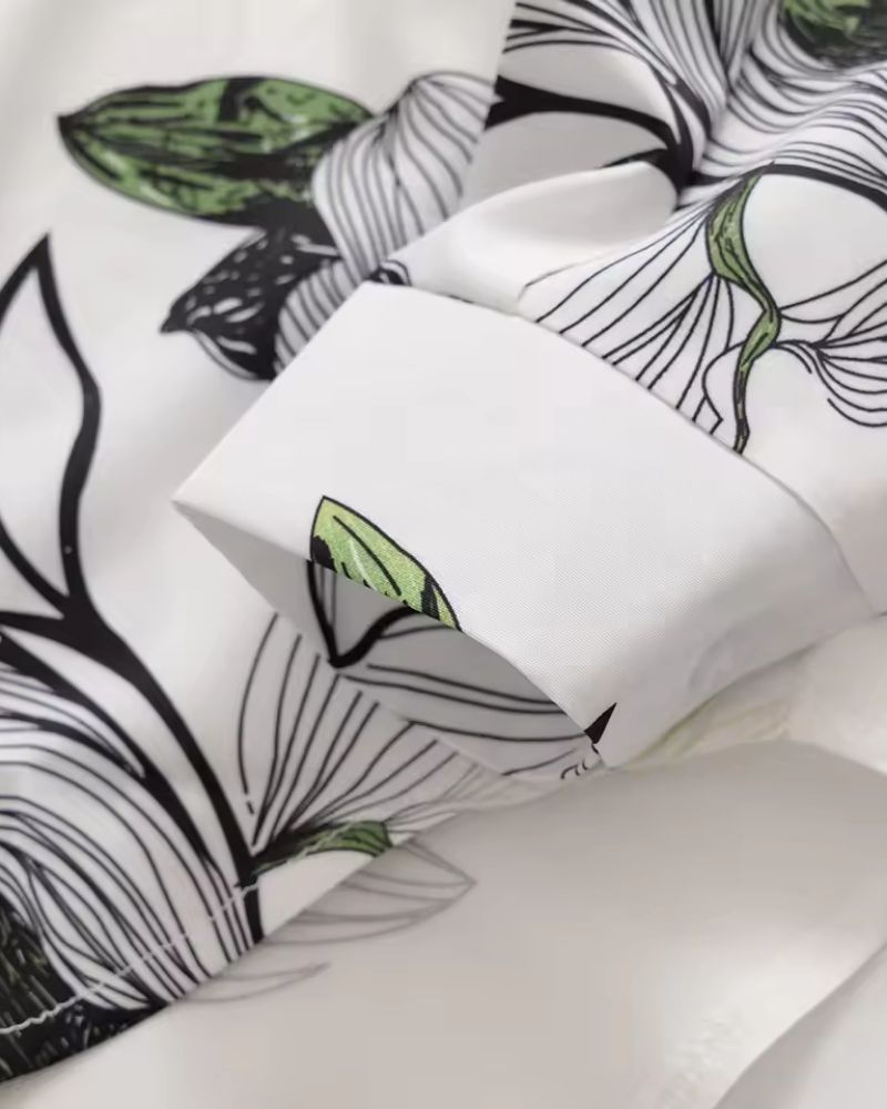 Cuff detail of Opaline Botanica botanical print shirt in white and green