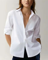Elegant white tailored rayon blouse styled minimally for modern women

