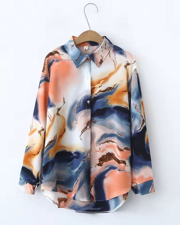 Elegant women's abstract marbled rayon shirt in peach, navy, and ivory tones with a point collar

