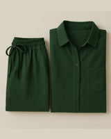Flat lay of forest green button-up shirt and drawstring wide-leg pants


