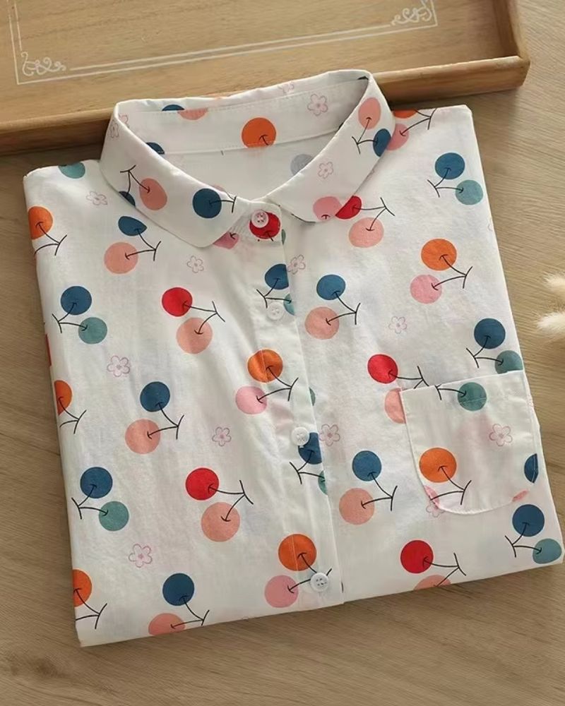 “Folded rayon floral shirt with button-down front and Peter Pan collar – Bubbly Botanica”

