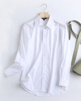 Front view of luxury white rayon shirt with classic buttons and cuff details

