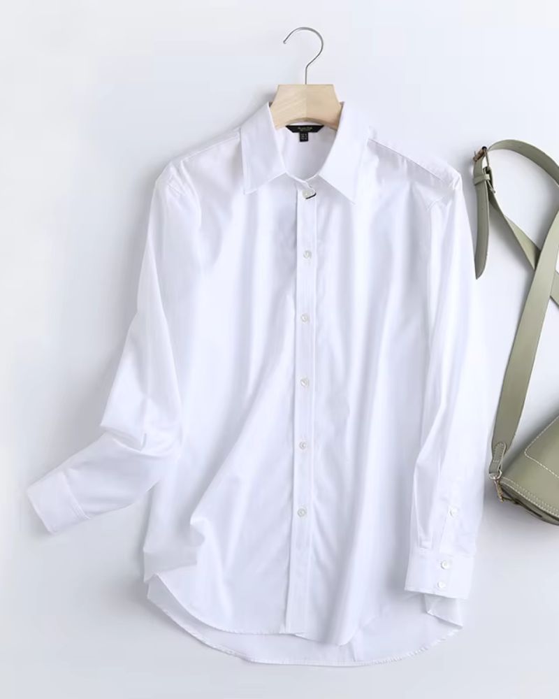 Front view of luxury white rayon shirt with classic buttons and cuff details

