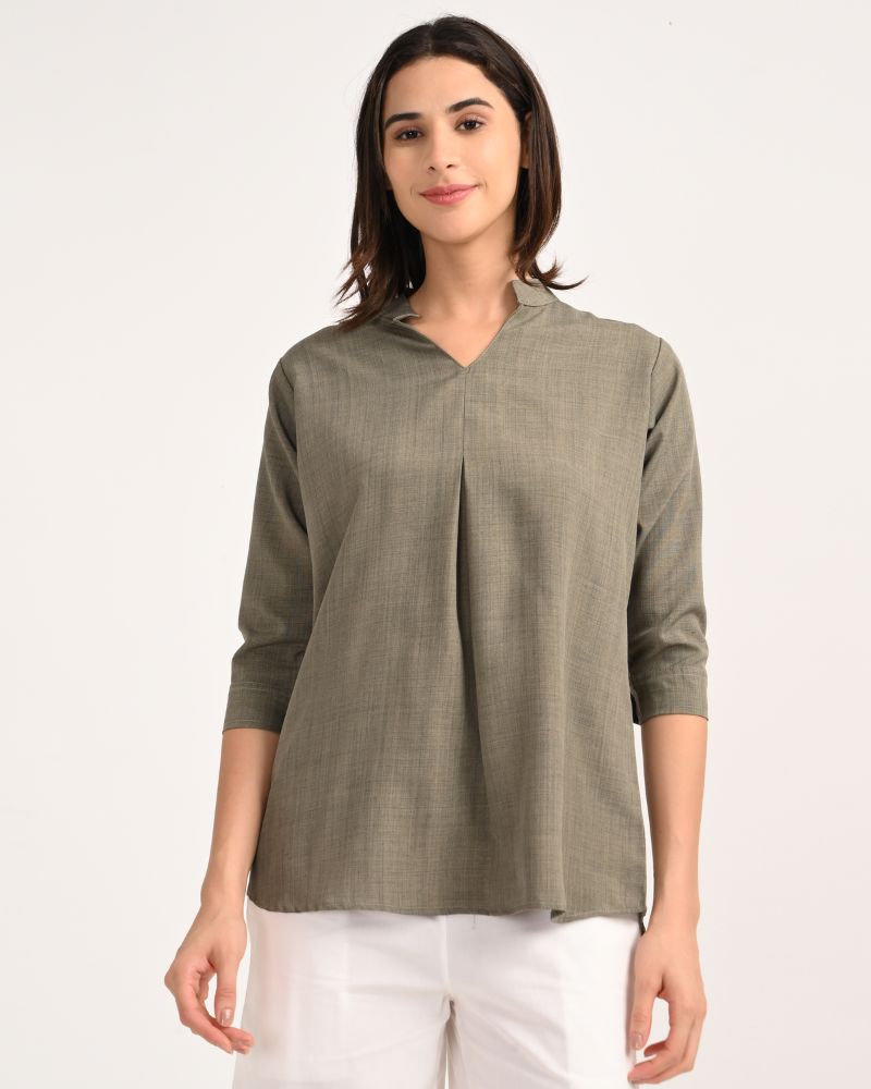 Front view of women’s olive green linen blend short kurta with V-neck and 3/4 sleeves