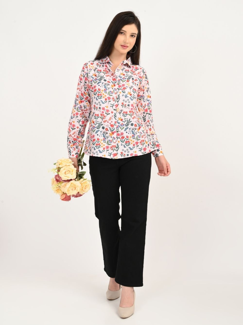 Full look of Floral Symphony floral shirt styled with black pants