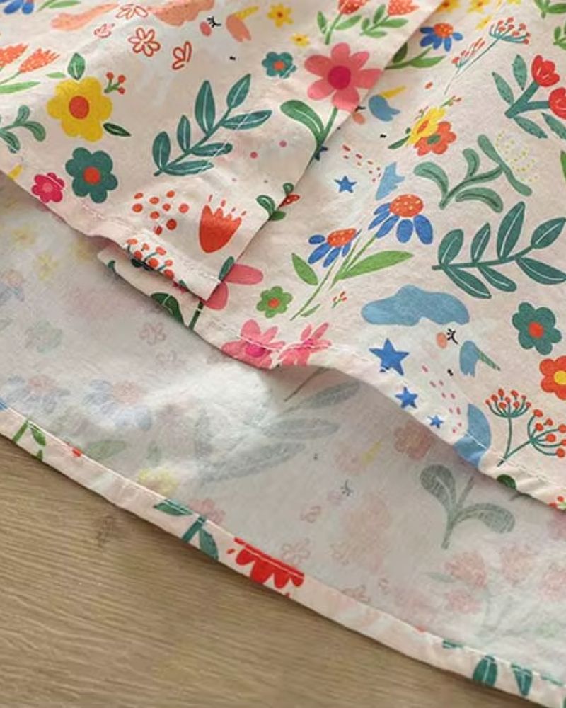 Hemline stitching and print details on La Lune Botanique rayon shirt showcasing soft fabric drape

