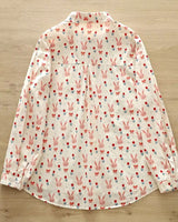 Lightweight women’s blouse with pink bunny, tulip, and bow print on white background

