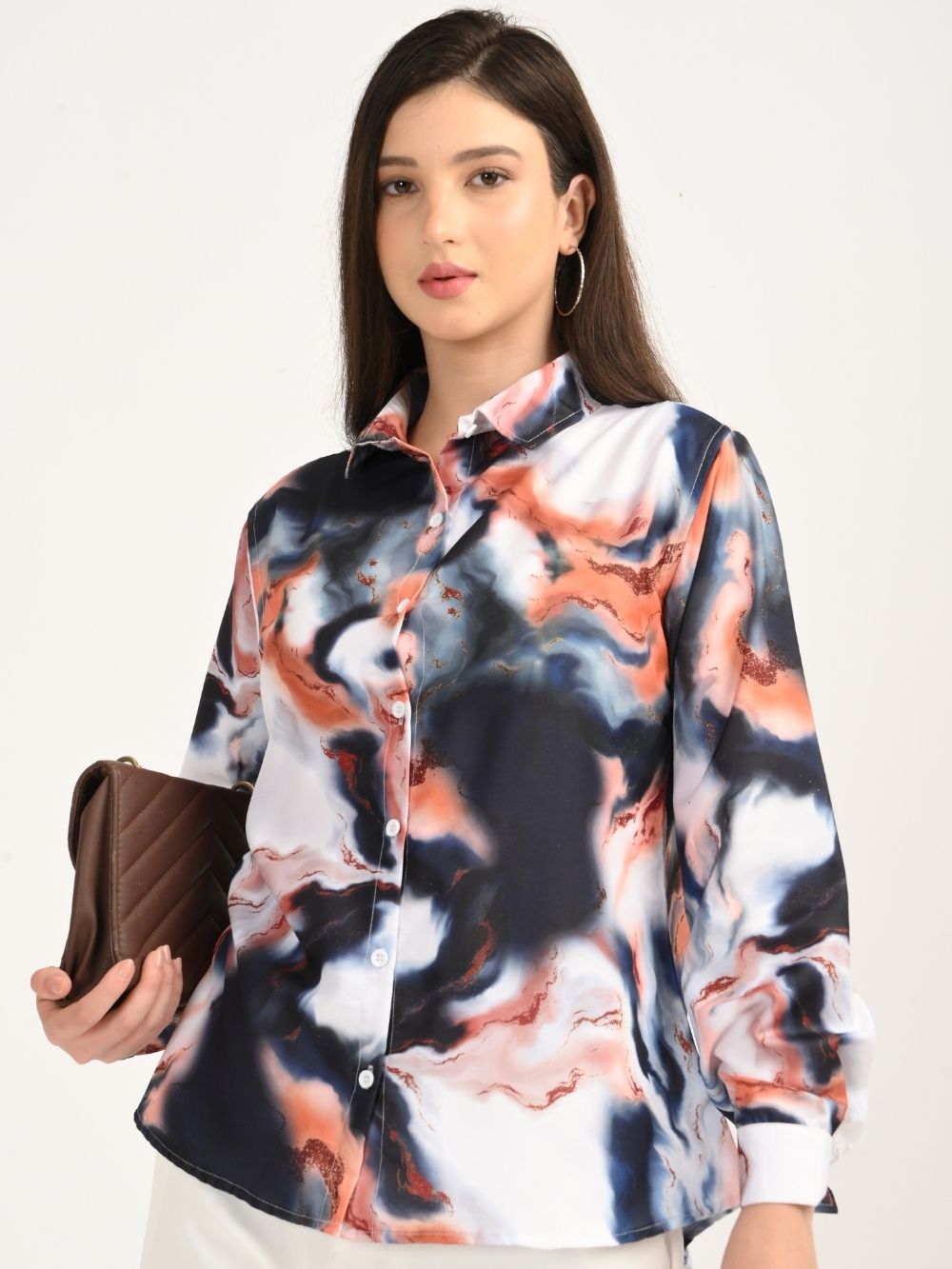 Model styling Mystic Marble shirt with clutch