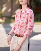 Side view of model in Love Notes Shirt pink hearts and rolled sleeves

