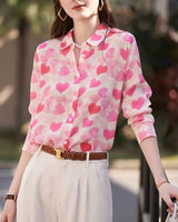 Side view of model in Love Notes Shirt featuring pink hearts and rolled sleeves

