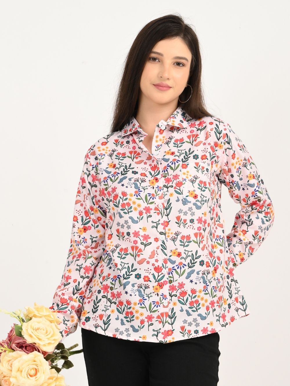 Woman in Floral Symphony shirt holding flowers front pose