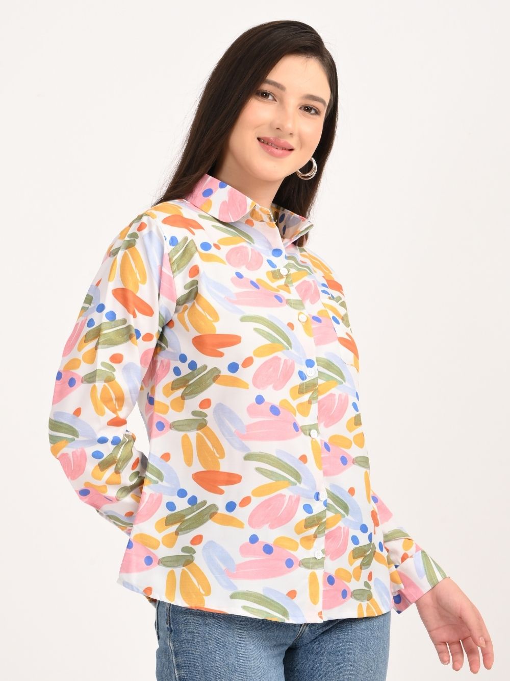 Woman posing in colorful brushstroke shirt with sunglasses