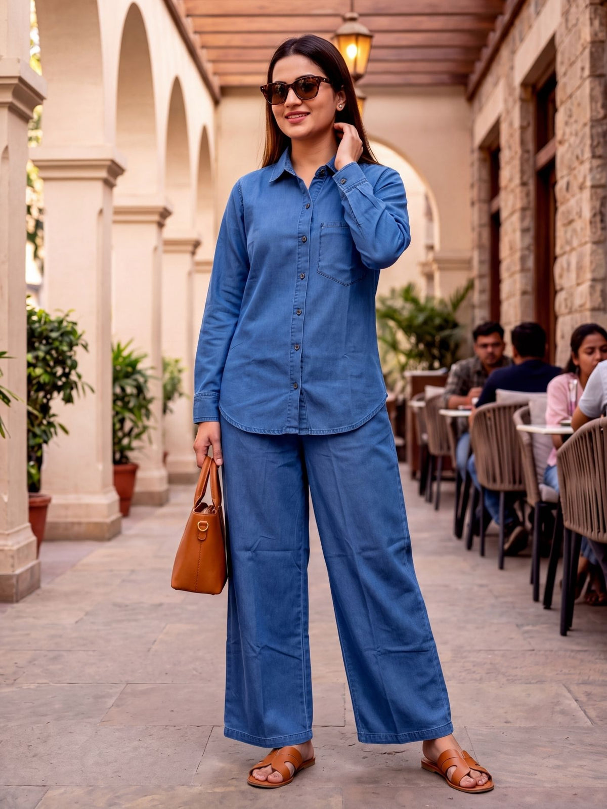 Woman walking in the Lucetta denim shirt and palazzo co-ord set