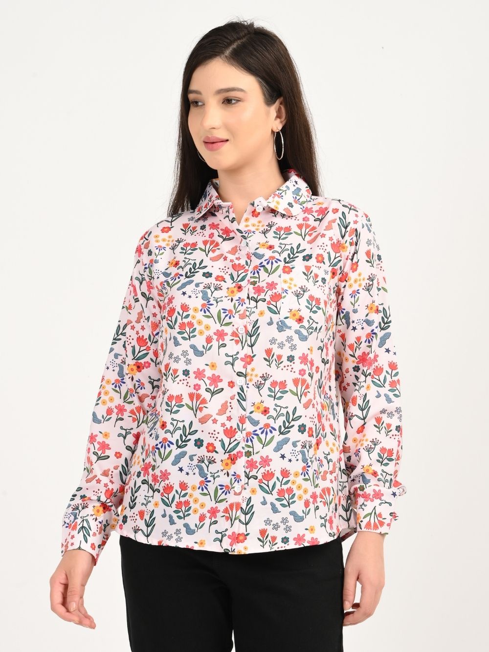 Woman wearing Floral Symphony shirt looking side with smile