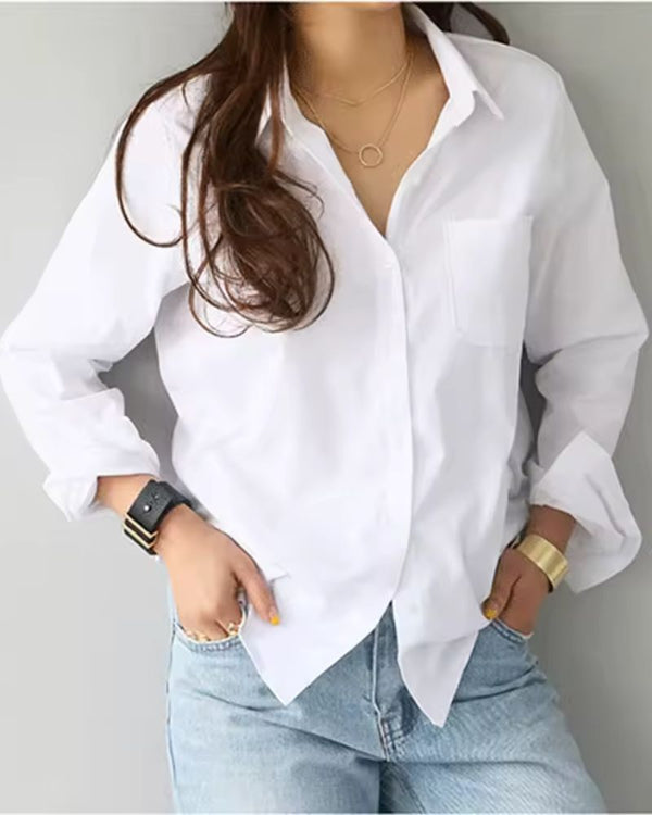 Woman wearing premium white rayon shirt with rolled sleeves and layered necklaces

