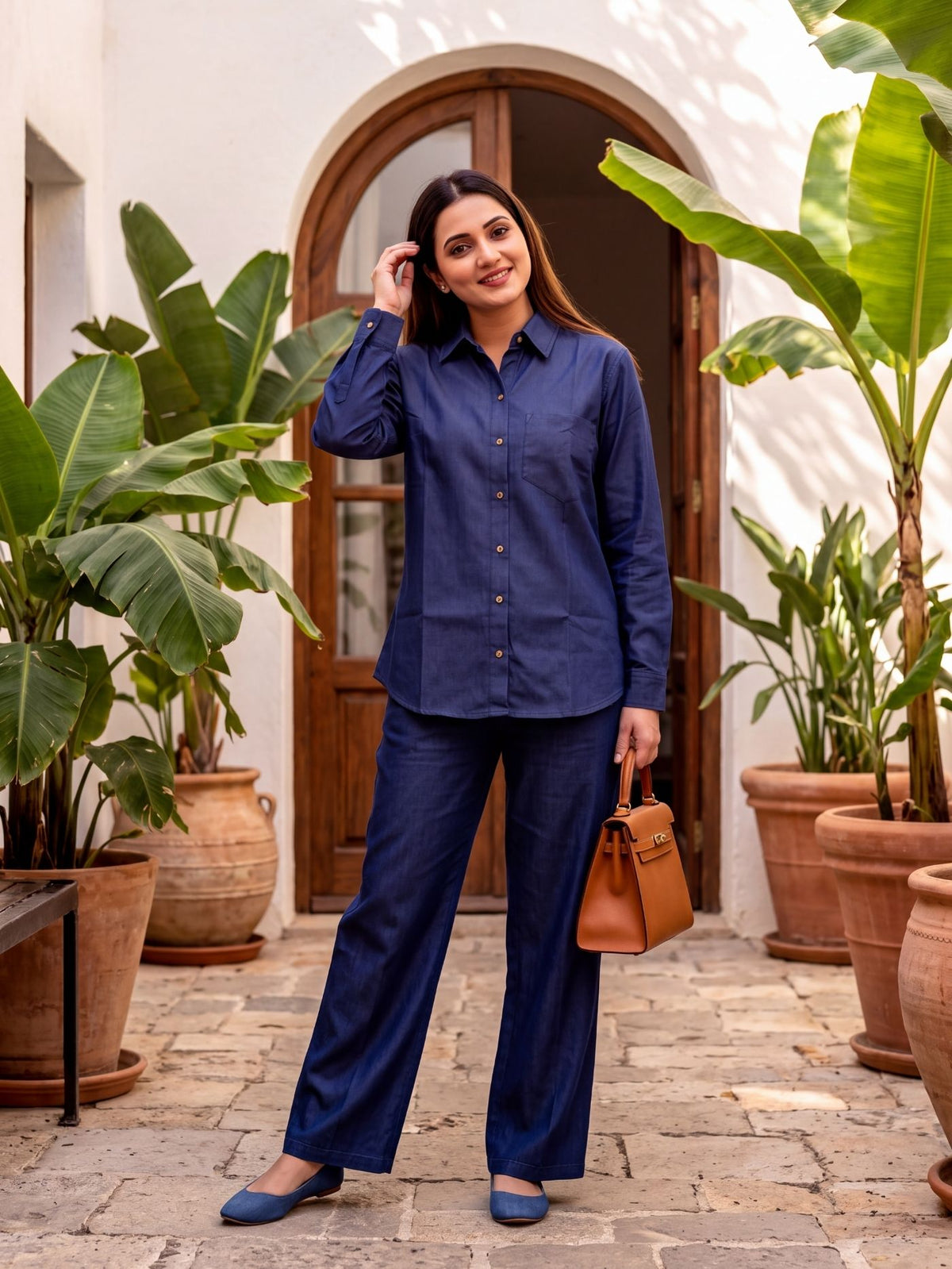 Woman wearing the Indira Dark Indigo Denim Co-Ord Set at an outdoor café