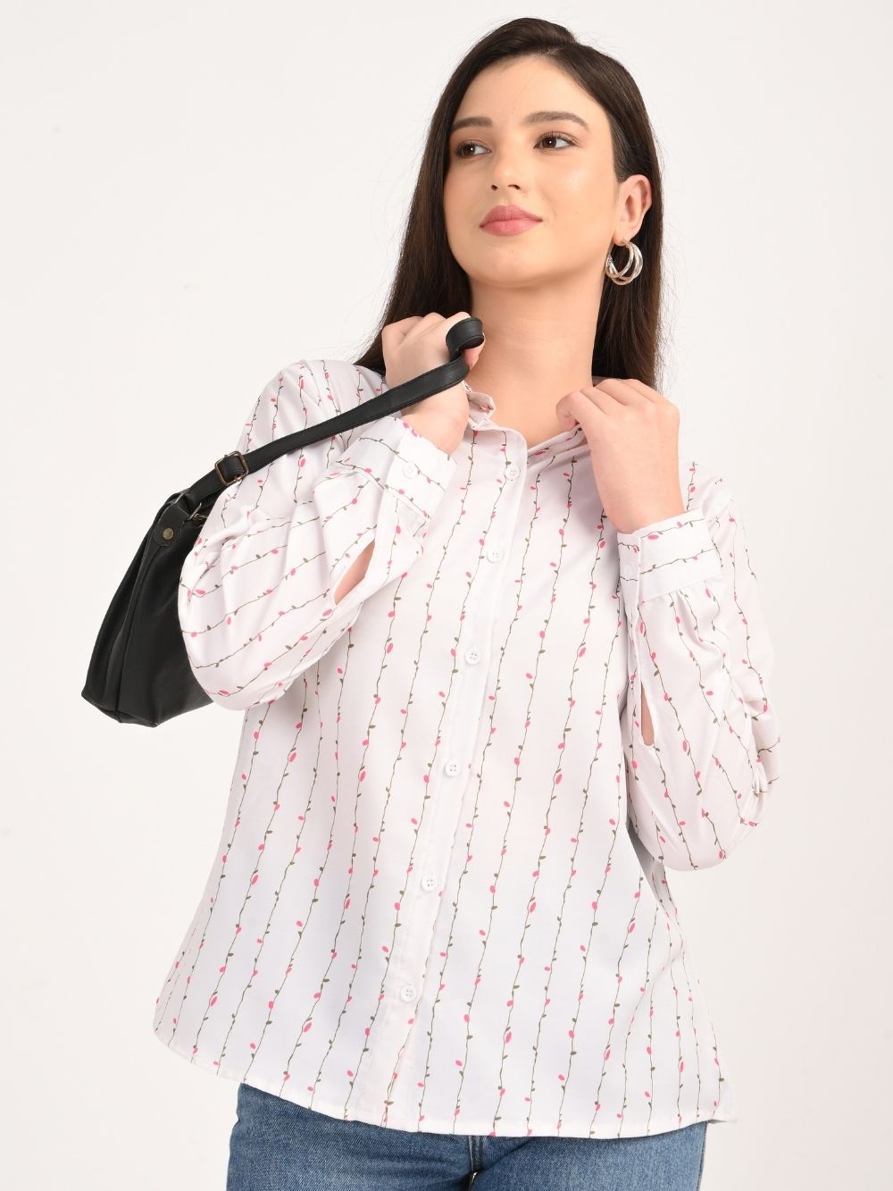 Woman wearing white blossom stripe rayon shirt with black bag