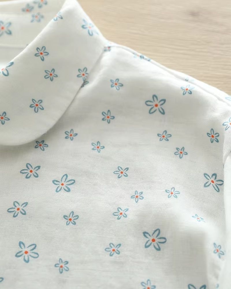 Zoomed view of rounded collar and shoulder stitching of Celeste Bloom women's floral rayon blouse

